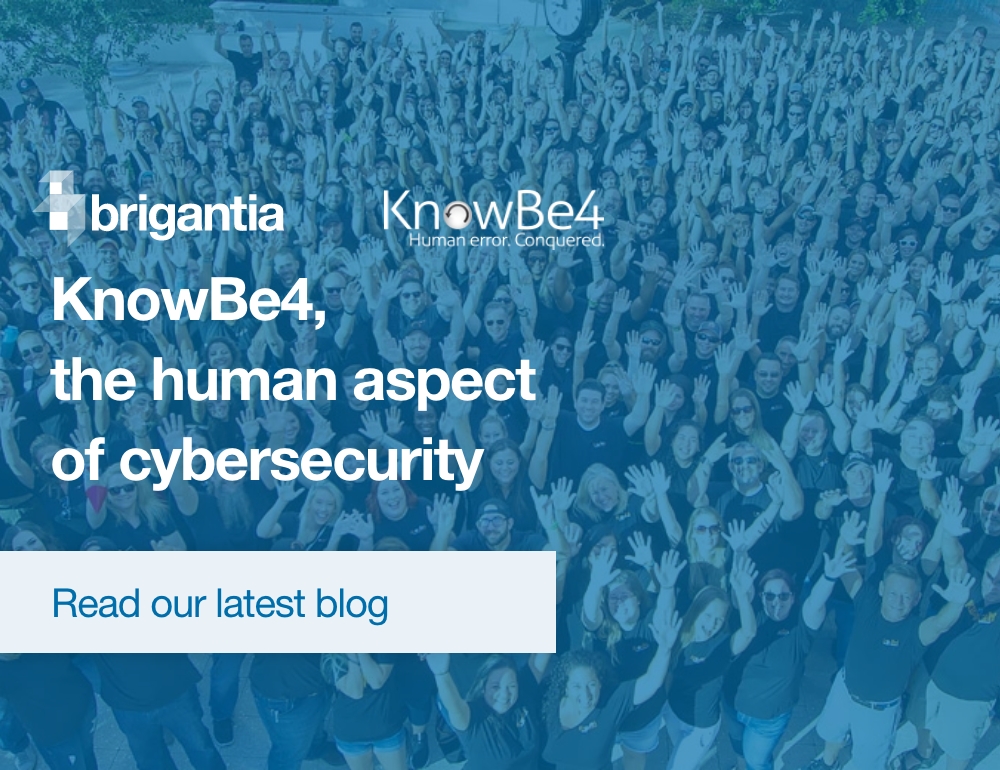 Large group image of KnowBe4 team all with hands in the air.